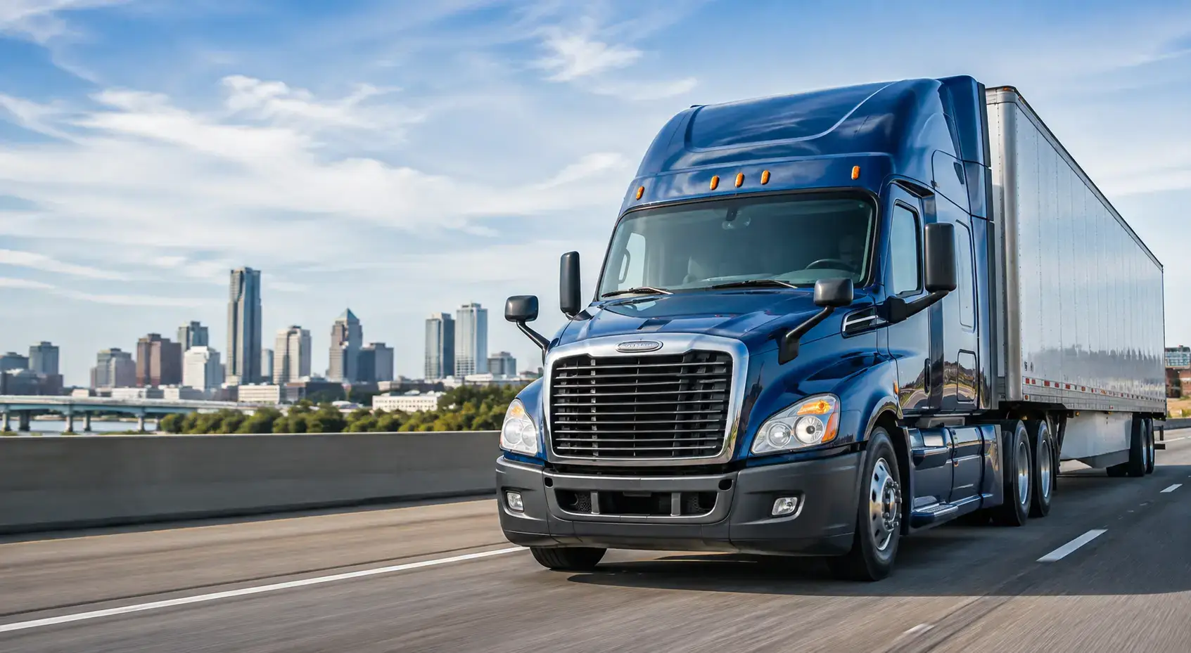 Blue commercial semi truck representing Heavy Duty Journal's free DOT Status Check and FMCSA carrier lookup tool